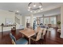 Open-concept dining room leading to a cozy living area, perfect for entertaining and everyday living at 2242 Terrabrook Ln, Charleston, SC 29412