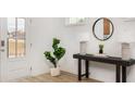 Bright entryway featuring a stylish console table, decorative mirror, and modern decor at 252 Abercom Place Dr, Moncks Corner, SC 29461