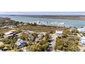 Picturesque coastal community featuring a marina, waterfront homes and scenic views of the inlet at 31 9Th Ave, Folly Beach, SC 29439