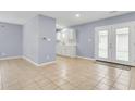 Bright open dining area adjacent to the kitchen with views to the back through glass panel doors at 3316 Island Estates Dr, Johns Island, SC 29455