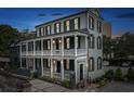Beautiful two-story home with large balconies, traditional shutters, and a welcoming facade, perfect for Southern living at 5 Alexander St, Charleston, SC 29401