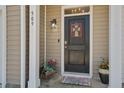 Inviting front door featuring a welcome mat, lovely decor, and sidelight at 509 Nadir Ct, Summerville, SC 29486