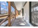 Covered front porch showcasing stylish wood railings and providing a shaded outdoor space at 905 Battery Way, Mount Pleasant, SC 29464