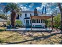 Charming backyard features a spacious deck with a pergola, seating, and lush landscaping at 960 Mooring Dr, Charleston, SC 29412