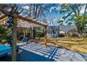 Enjoy the outdoors on this backyard deck with pergola, perfect for entertaining or relaxing at 960 Mooring Dr, Charleston, SC 29412