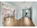 Inviting foyer with hard wood floors, leading to a living space, and views of the front yard at 103 Old Tree Rd, Goose Creek, SC 29445