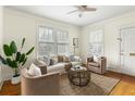 Inviting living room featuring hardwood floors, neutral furniture, and bright, natural light at 103 Tall Oak Ave, Charleston, SC 29407