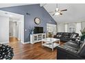 A spacious living room featuring wood floors, high ceilings, and a blue accent wall at 105 Gatewood St, North Charleston, SC 29418