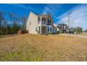 Beautiful home showcasing a well-kept lawn, and a two-car garage, under a bright blue sky at 1273 Discovery Dr, Ladson, SC 29456