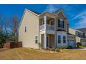 Lovely home with a charming porch, two-car garage, and beautiful landscaping in a suburban neighborhood at 1273 Discovery Dr, Ladson, SC 29456