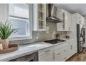 Sleek kitchen featuring stainless steel appliances, light countertops, and subway tile backsplash at 130 Wappoo Trace Ln, Summerville, SC 29486