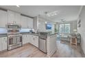 Updated kitchen with stainless steel appliances, granite countertops, and an open design at 135 Pier View St # 203, Charleston, SC 29492