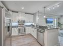 Modern kitchen with stainless steel appliances, granite countertops, and an open layout at 135 Pier View St # 203, Charleston, SC 29492