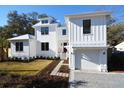 Stunning two-story home featuring a brick driveway, attached garage and beautiful landscaping at 1495 Pocahontas St, Mount Pleasant, SC 29464
