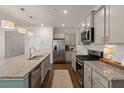 Modern kitchen with stainless steel appliances, granite countertops, and a central island at 162 Cherry Grv Dr, Summerville, SC 29483
