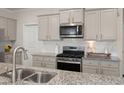 Well-equipped kitchen featuring granite counters, stainless steel appliances, and ample cabinet space at 162 Cherry Grv Dr, Summerville, SC 29483