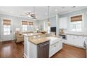 Bright kitchen with stainless steel appliances, granite counters, and a farmhouse sink at 1676 Paradise Lake Dr, Mount Pleasant, SC 29464