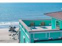Rooftop patio with seating and ocean view, offering a serene escape with stunning coastal scenery at 1699 E Ashley Ave # B, Folly Beach, SC 29439