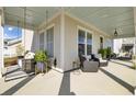 Inviting porch with a swing, comfortable seating, and a stylish outdoor rug at 201 Symphony Ave, Summerville, SC 29486