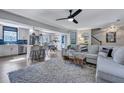 Open concept living space features a cozy living room area, a kitchen with blue backsplash, and dining area at 2029 Country Manor Dr, Mount Pleasant, SC 29466