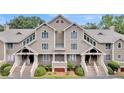 Charming condo building with stairs leading up to covered entryways at 2774 Hidden Oak Dr, Seabrook Island, SC 29455