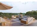 Rooftop deck, complete with comfortable outdoor seating and dining area, offers the perfect space for relaxation and entertainment at 317 Longshore St # 317, Charleston, SC 29492