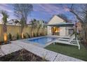 Inviting backyard pool, outdoor seating, and lush landscaping at 34 Percy St, Charleston, SC 29403