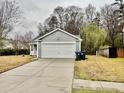 Charming single Gathering home featuring a well-maintained front yard and attached two car garage at 344 Eagle Ridge Rd, Summerville, SC 29485