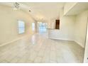 Bright, open-concept living space with vaulted ceilings and tile floors leading to an outdoor patio at 344 Eagle Ridge Rd, Summerville, SC 29485