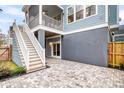 Outdoor patio with stylish pavers and stairs leading to a screened porch at 3726 Apiary Ln, Johns Island, SC 29455