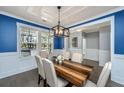 Elegant dining space with stylish table, chairs, and wainscoting at 414 Hamlet Cir, Goose Creek, SC 29445