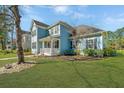 Charming two-story home with a well-maintained lawn and inviting front porch at 414 Hamlet Cir, Goose Creek, SC 29445