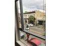 Exterior buildings seen through a window; a blend of urban life visible from inside at 487 King St # 201, Charleston, SC 29403