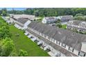This aerial view shows an ideal townhome community, a great location near stores and a beautiful landscape at 711 Hemingway Cir, Summerville, SC 29483