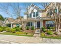 Charming townhome with well-manicured lawn and established shrubbery, offering a welcoming curb appeal at 7977 Shadow Oak Dr, North Charleston, SC 29406