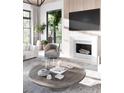 Cozy living room featuring a fireplace, modern decor, and comfortable seating area at 925 Fish Camp Rd, Charleston, SC 29492