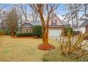 Attractive brick home with manicured lawn, driveway, and an attached two-car garage at 109 Nelson Ct, Summerville, SC 29485