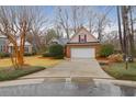 Attractive brick home with manicured lawn, driveway, and an attached two-car garage at 109 Nelson Ct, Summerville, SC 29485