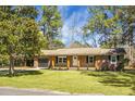 Traditional brick home with an attached garage and fresh landscaping at 113 Harter Dr, Summerville, SC 29485