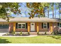 Inviting front porch with brick columns and manicured landscaping at 113 Harter Dr, Summerville, SC 29485