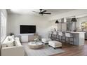 Open-concept living room and kitchen with modern decor and ample seating at 113 Harter Dr, Summerville, SC 29485