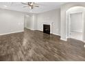 Living room with fireplace, hard wood floors and archways to other rooms at 139 Gazania Way, Charleston, SC 29414