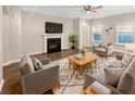 Comfortable living room featuring a fireplace, ceiling fan and neutral colored walls at 139 Gazania Way, Charleston, SC 29414
