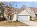 Charming single-story home with a two-car garage and well-maintained front yard at 1516 Oldenburg Dr, Mount Pleasant, SC 29466