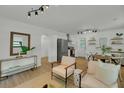 Airy and spacious living area showcasing modern finishes and an open layout to the kitchen at 1563 Traywick Ave, Johns Island, SC 29455