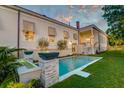 Beautiful backyard showcasing a modern pool, elegant water feature, and manicured landscaping at 1714 Middle St, Sullivans Island, SC 29482