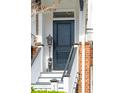 Close-up of front door and stairs with brick details and black door at 1930 Carolina Towne Ct, Mount Pleasant, SC 29464