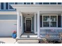 Inviting front porch with white columns, a 