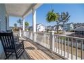 Inviting porch with rocking chairs and a neighborhood view at 2305 Sturgeon, Johns Island, SC 29455