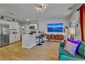 Stylish living room featuring an open kitchen and comfortable seating at 2379 Sorentrue Ave, North Charleston, SC 29405